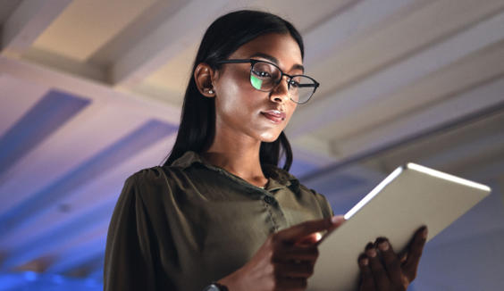 Young business woman looking at a tablet